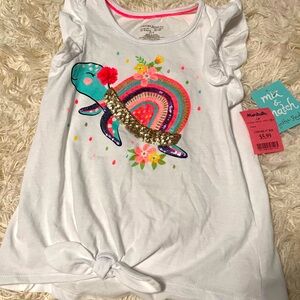 Girls size 7/8 fashion tee with ruffle sleeves.